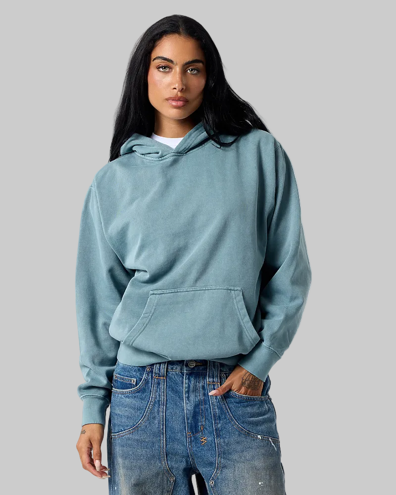 Model wearing Smart Blanks 8005 ultra heavyweight fashion hoodie in Vintage Dusty Blue, front view, 12 oz 400 GSM blank
