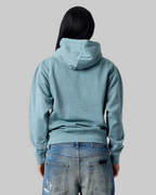 Model wearing Smart Blanks 8005 ultra heavyweight fashion hoodie in Vintage Dusty Blue, back view, 12 oz 400 GSM blank