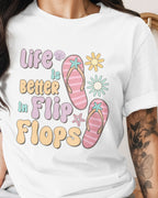 Person wearing a white t-shirt with 'Life is better in flip flops' design.