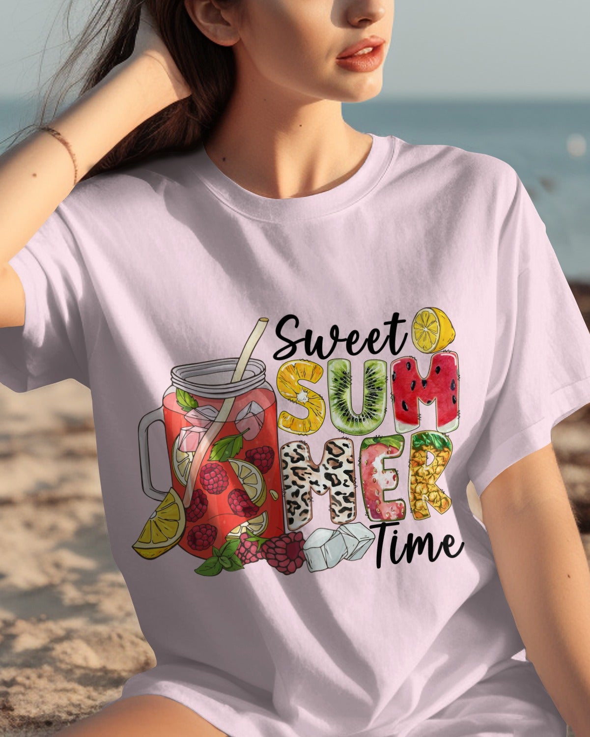 Woman wearing a 'Sweet Summer Time' t-shirt on a beach