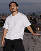 PROL LINE heavyweight 100% cotton tee in White, on model on a rooftop, 6 oz 200 GSM blank